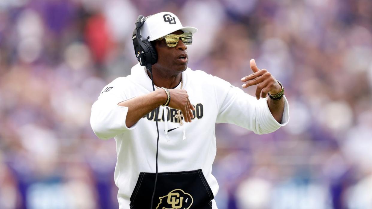 head coach deion sanders of the colorado buffaloes wearing blenders sunglasses on sidelines