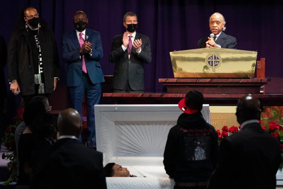 <p>The Rev. Al Sharpton, right, speaks over the casket of Daunte Wright, alongside attorneys Antonio Romanucci, center, and Ben Crump, center left, and the Rev. Greg Drumwright, left, Wednesday, April 21, 2021, in Minneapolis. The 20-year-old Wright was killed by former Brooklyn Center police Officer Kim Potter during a traffic stop. </p> ((AP Photo/Julio Cortez))