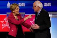 Democratic 2020 U.S. presidential candidates Senator Elizabeth Warren and Senator Bernie Sanders talk before the tenth Democratic 2020 presidential debate at the Gaillard Center in Charleston