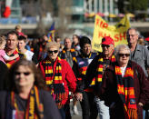 Fans walk to the ground to pay their respects.