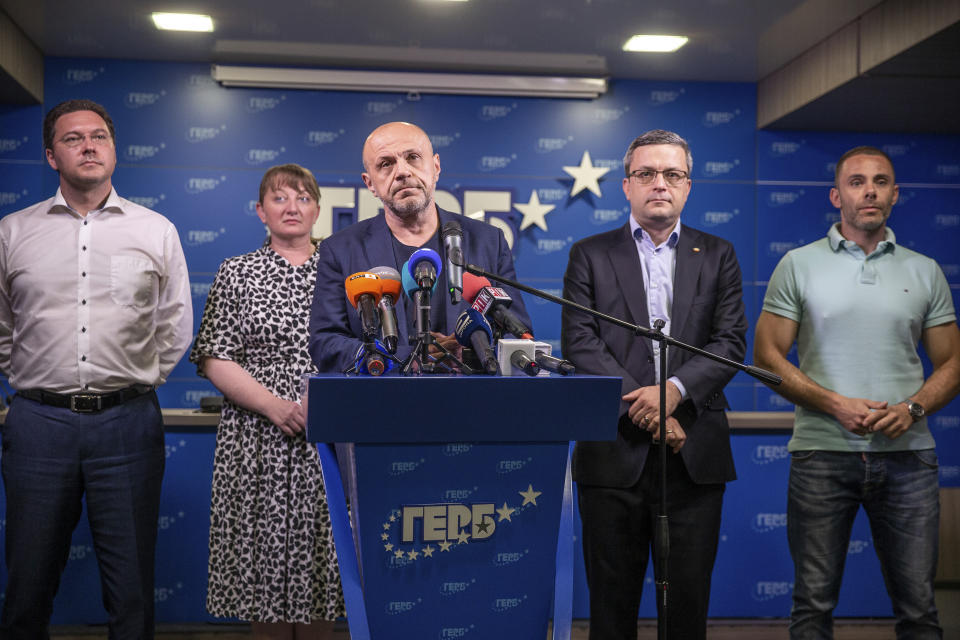 Former deputy prime minister Tomislav Donchev, center, and GERB political party officials attend a news conference in capital Sofia, Bulgaria on Sunday, July 11, 2021. Voter apathy dominated Bulgaria's early election on Sunday, raising the prospect of yet another fractured parliament that will struggle to form a viable governing coalition. (AP Photo/Visar Kryeziu)