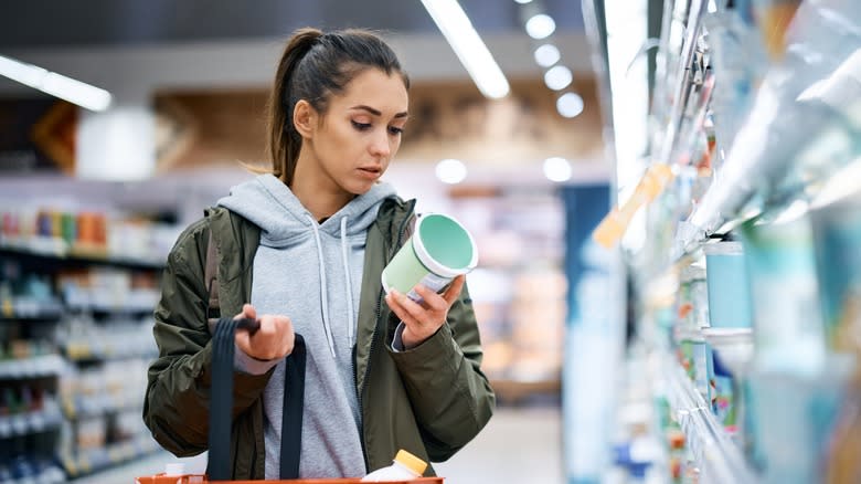 Woman looking at nutrition label