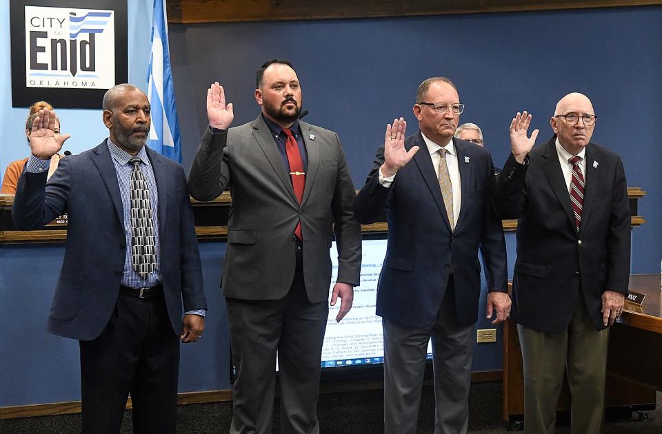From left to right, Commissioner Derwin Norwood, Commissioner Judd Blevins, Mayor David Mason and Commissioner Ron Stallings, take their oaths of office May 1 during the Enid City Council meeting.