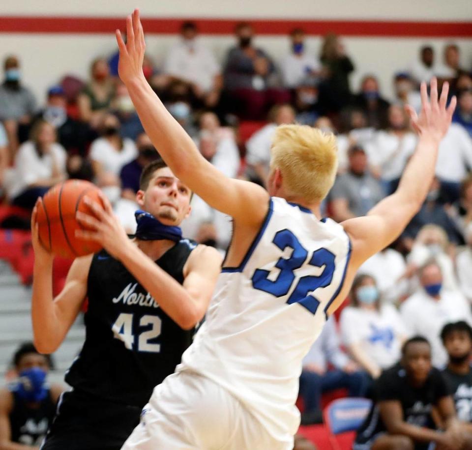 North Forney center Gavin Sterling (42) looks to shoot against Joshua center Noah Smith (32) during the second half of a 5A region 2 bi-district basketball game at Grapevine High School in Grapevine, Texas, Tuesday, Feb. 23, 2021. North Forney defeated Joshua 61-50. (Special to the Star-Telegram Bob Booth)