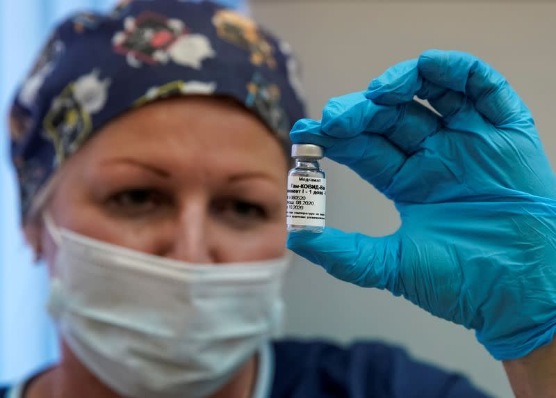 FILE PHOTO: A nurse shows Russia's "Sputnik-V" vaccine against the coronavirus disease (COVID-19) prepared for inoculation in a post-registration trials stage at a clinic in Moscow