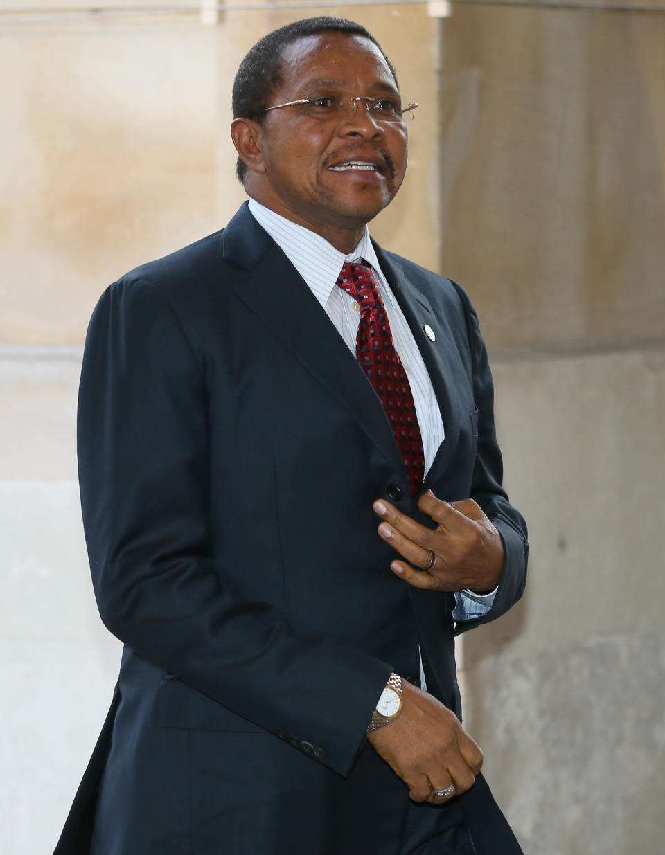 The President of Tanzania Jakaya Kikwete arrives at Lancaster House to attend the Illegal Wildlife Trade Conference in London,Thursday, Feb. 13, 2014. (AP Photo/Alastair Grant, Pool)