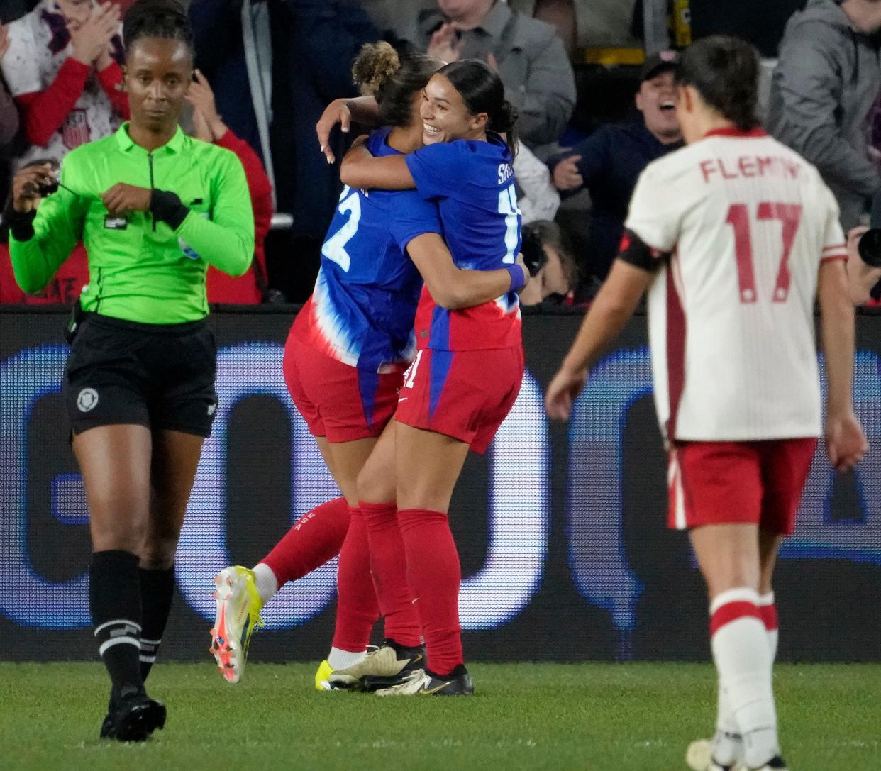 April 9, 2024; Columbus, Ohio, USA; 
Forward Sophia Smith (11) of the United States embraces defender Tierna Davidson (12) after scoring a goal during the second half of the 2024 SheBelieves Cup championship soccer match against Canada on Tuesday at Lower.com Field in Columbus, Ohio.