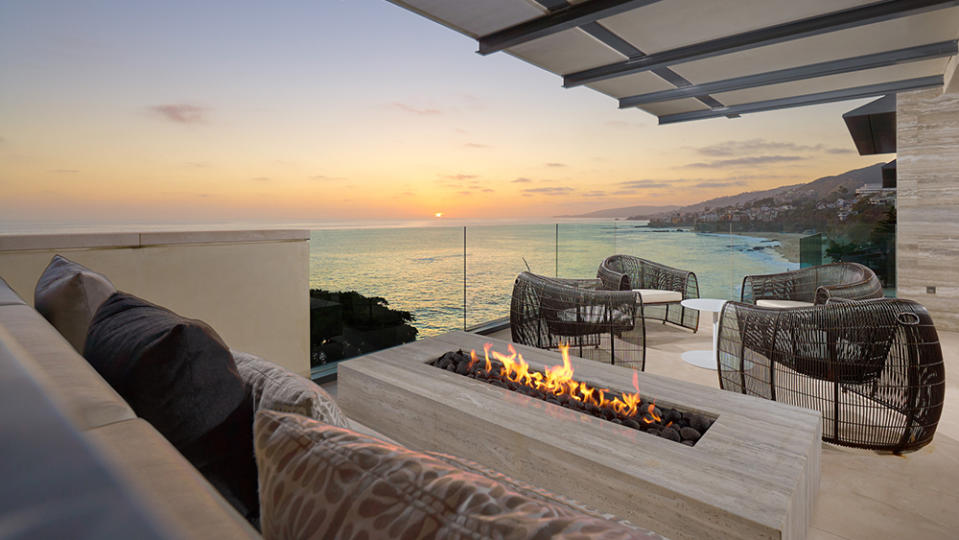 The outdoor fireplace. - Credit: Photo: Courtesy of Leigh Ann Rowe and Toby Ponnay/Sotheby’s International Realty