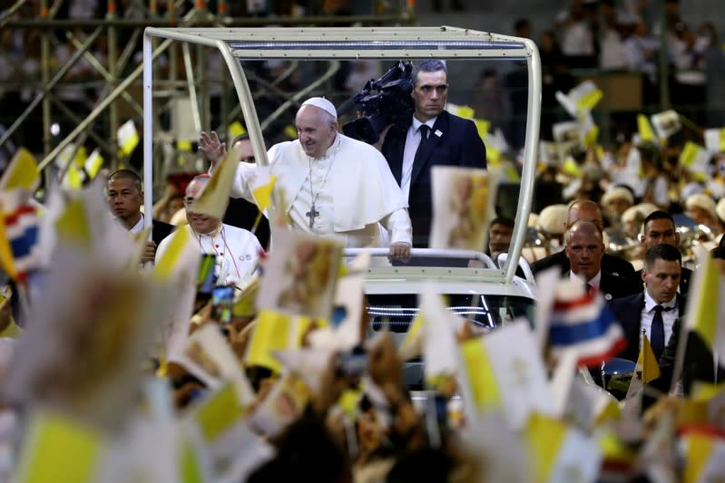 Pope Francis arrives to lead the Holy Mass at the National Stadium in Bangkok