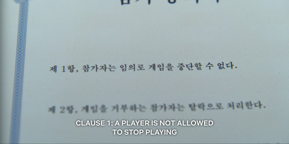 A closeup of a contract that says Clause 1: a player is not allowed to stop playing