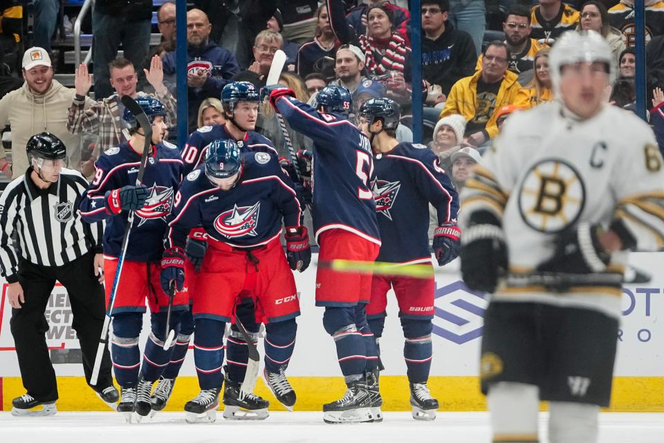 Nov 27, 2023; Columbus, Ohio, USA; Teammates celebrate a goal by Columbus Blue Jackets defenseman Ivan Provorov (9) during the second period of the NHL game against the Boston Bruins at Nationwide Arena.