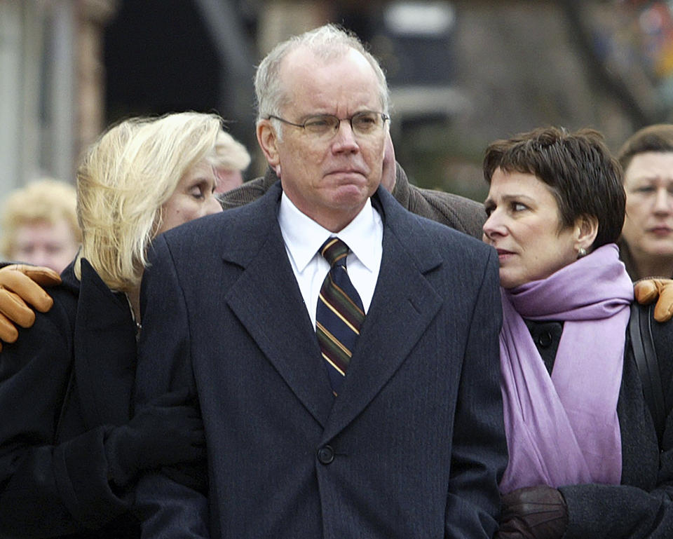 FILE - Joey Meyer, center, son of former DePaul basketball coach Ray Meyer, leads his family toward St. Vincent de Paul Church in Chicago, March 21, 2006, for his father's funeral service. Joey, who played at DePaul and coached the Blue Demons to seven NCAA Tournament appearances in 13 seasons, has died. He was 74. Meyer died Friday, Dec. 29, 2023, in the Chicago suburb of Hinsdale, surrounded by family, DePaul said in a release. (AP Photo/Nam Y. Huh, File)