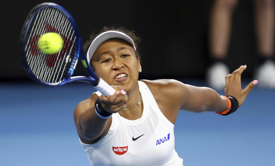 Naomi Osaka of Japan makes a forehand return during her semifinal match against Karolina Pliskova of the Czech Republic at the Brisbane International tennis tournament in Brisbane, Australia, Saturday, Jan. 11, 2020. (AP Photo/Tertius Pickard)