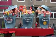 <p>A carnival float, depicting people in bins, is pictured during a carnival parade on Rose Monday on Feb. 12, 2018 in Duesseldorf, western Germany. The writings read “Air Berlin employees, dummped by Lufthansa”. Germany. (Photo: Patrik Stollarz/Getty Images) </p>