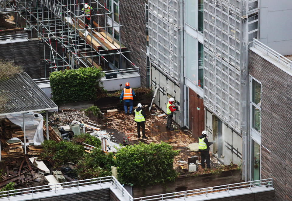 Contractors undertake works at a residential property in Paddington, London, as part of a project to remove and replace non-compliant cladding. Picture date: Wednesday January 20, 2021.