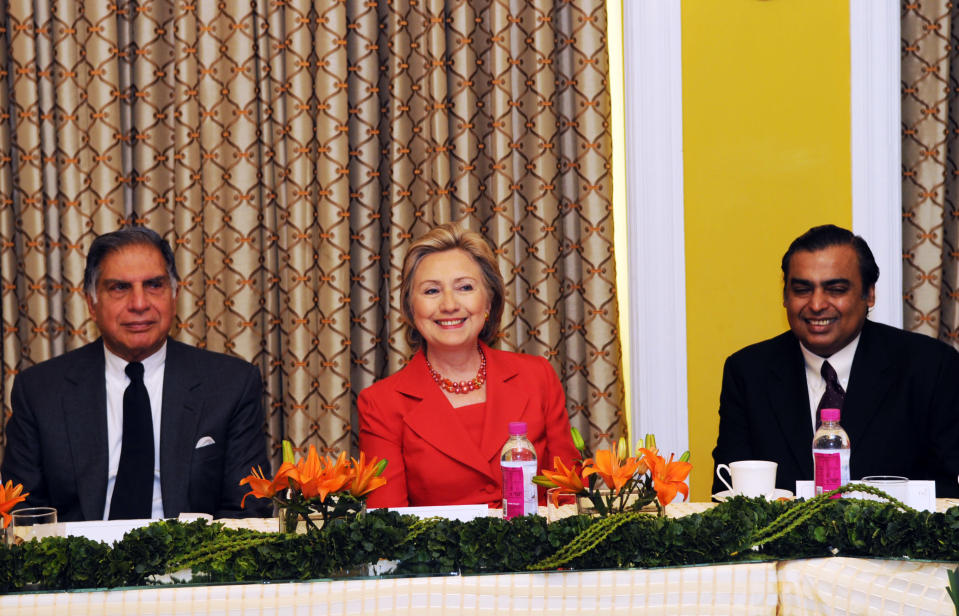 In this handout picture provided by the US State Department, US Secretary of State Hillary Rodham Clinton (C) meets with Tata Group Chairman Ratan Tata (L) and Reliance Industries Chairman and Managing Director Mukesh Ambani along with other prominent Indian business leaders at the Taj Mahal Palace Hotel in Mumbai on July 18, 2009. Clinton arrived in India hoping to deepen strategic ties with an emerging player on the world stage in security, trade, arms control and climate change. Her first stop in the country's financial and entertainment capital Mumbai, includes meetings with key business leaders, educational professionals and a women's group, as well as leading Bollywood actor Aamir Khan. In her maiden trip to the South Asian nation as Washington's chief diplomat, Clinton will also pay tribute to the 166 people who died in last year's Islamist militant attacks on the city. AFP PHOTO/HO