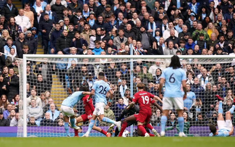 Manchester City's Ilkay Gundogan scores their side's third goal - Mike Egerton/PA Wire