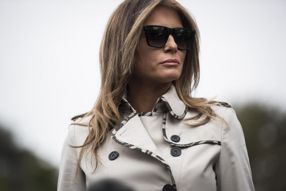 First lady Melania Trump listens as&nbsp;the president speaks to reporters on the South Lawn of the White House in early October. (Photo: Jabin Botsford/The Washington Post via Getty Images)