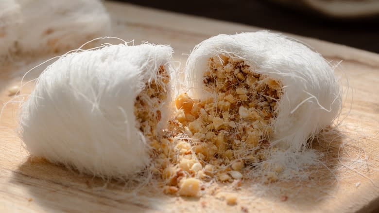 Dragon's beard candy with coconut and sesame seeds