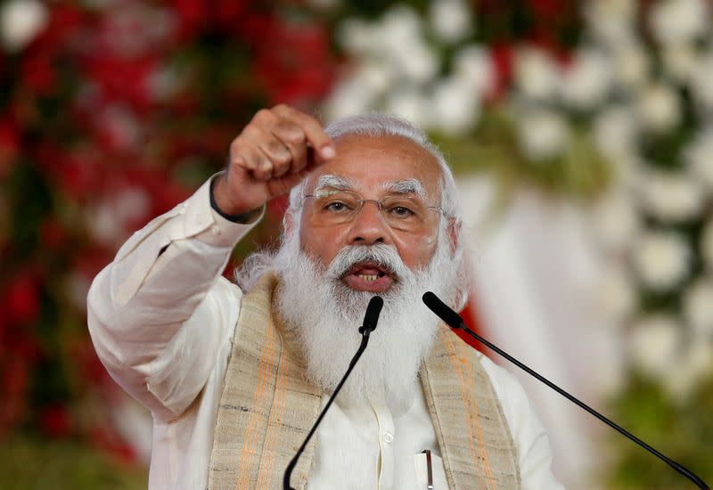 FILE PHOTO: India's PM Modi addresses a gathering before flagging off the "Dandi March", in Ahmedabad