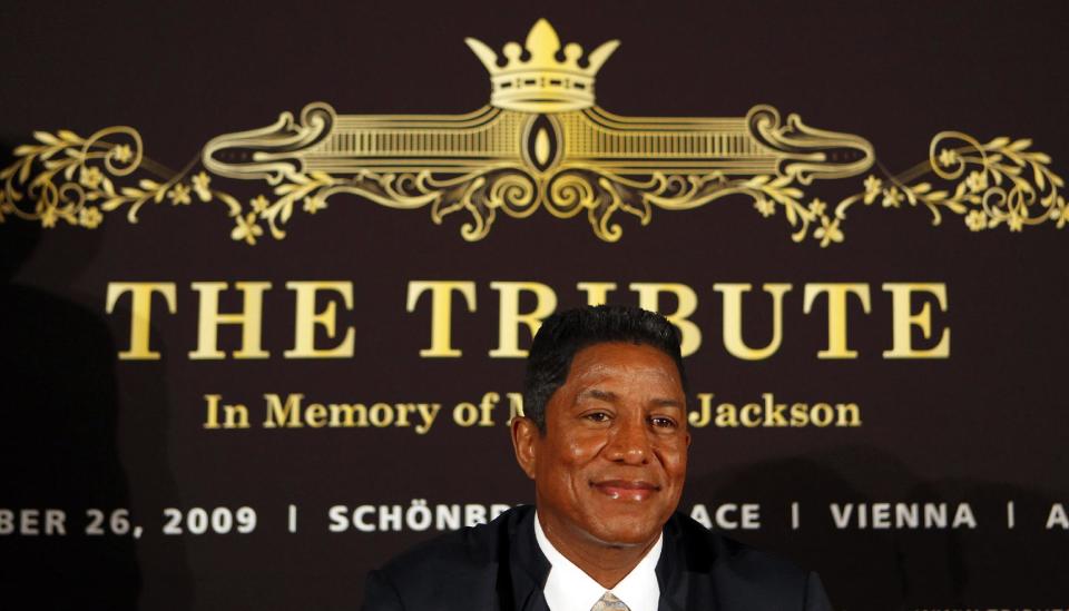 FILE - In this Sept. 10, 2009 file photo, Jermaine Jackson, bother of late U.S. pop star Michael Jackson, smiles prior to a press conference on "The Tribute - In Memory of Michael Jackson" in Berlin. Concert giant AEG Live filed a motion on Monday, Sept. 10, 2012 seeking Jermaine Jackson’s drafts and manuscripts for books on his superstar brother, claiming they may reveal important details that will help it defend against a lawsuit filed by Jackson family matriarch Katherine Jackson. (AP Photo/Franka Bruns, File)