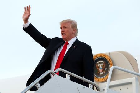 U.S. President Donald Trump waves at Joint Base Andrews, Maryland, U.S., upon his return to Washington after a weekend at the Trump National Golf Club in Bedminster, New Jersey, July 3, 2017. REUTERS/Yuri Gripas