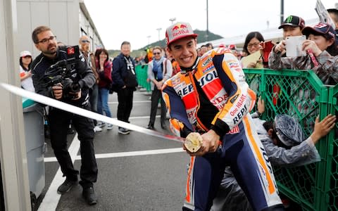 MotoGP - Japanese Grand Prix - Twin Ring Motegi circuit, Motegi, Japan - October 19, 2018 Repsol Honda's Marc Marquez holds a samurai sword after a practice session. REUTERS/Toru Hanai - Credit: TORU HANAI/reuters