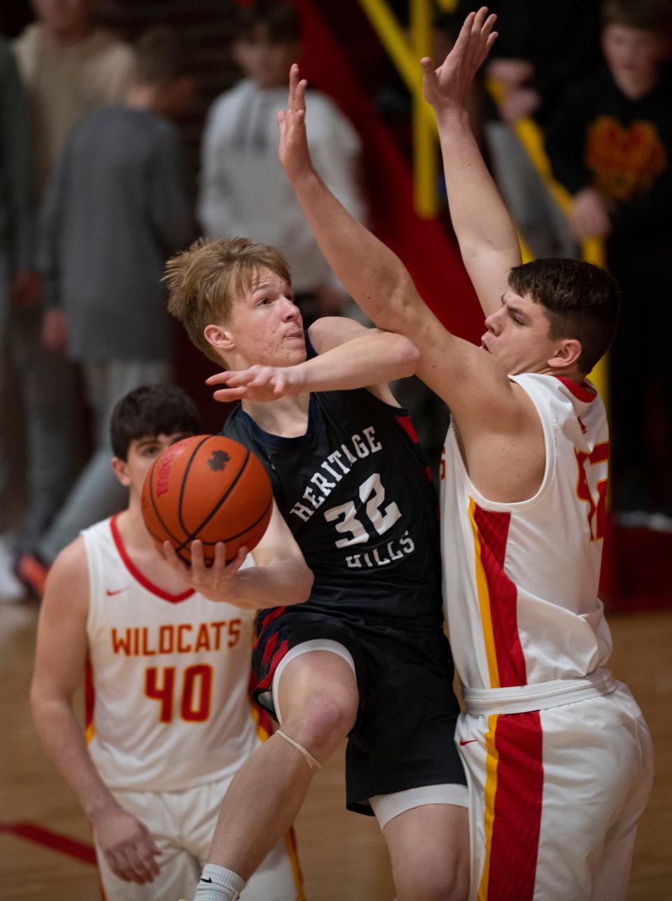 Heritage Hills’ Colten Hopf (32) shots against Mater Dei’s Mason Wunderlich (42) as the Mater Dei Wildcats play the Heritage Hills Patriots Friday, Jan. 27, 2023. 