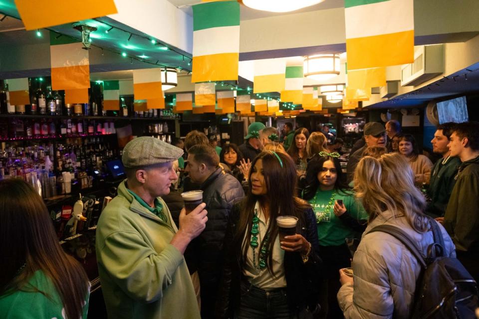 Bar patrons celebrate during the St. Patrick's Day Parade in New York City (AFP via Getty Images)