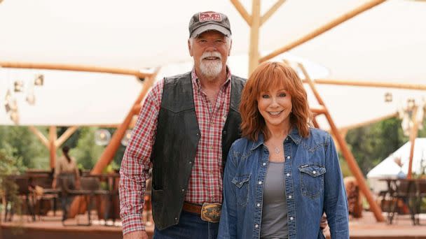 PHOTO: Rex Linn and Reba McEntire pose for a photo together on the set of ABC's 'Big Sky: Deadly Trails.' (Michael Moriatis/ABC)