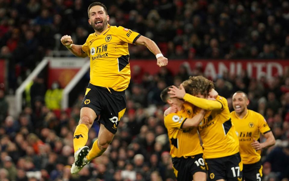 Wolverhampton Wanderers' Joao Moutinho celebrates after scoring his side's first goal during the English Premier League soccer match between Manchester United and Wolverhampton Wanderers at Old Trafford stadium in Manchester, England, Monday, Jan.3, 2022 - AP