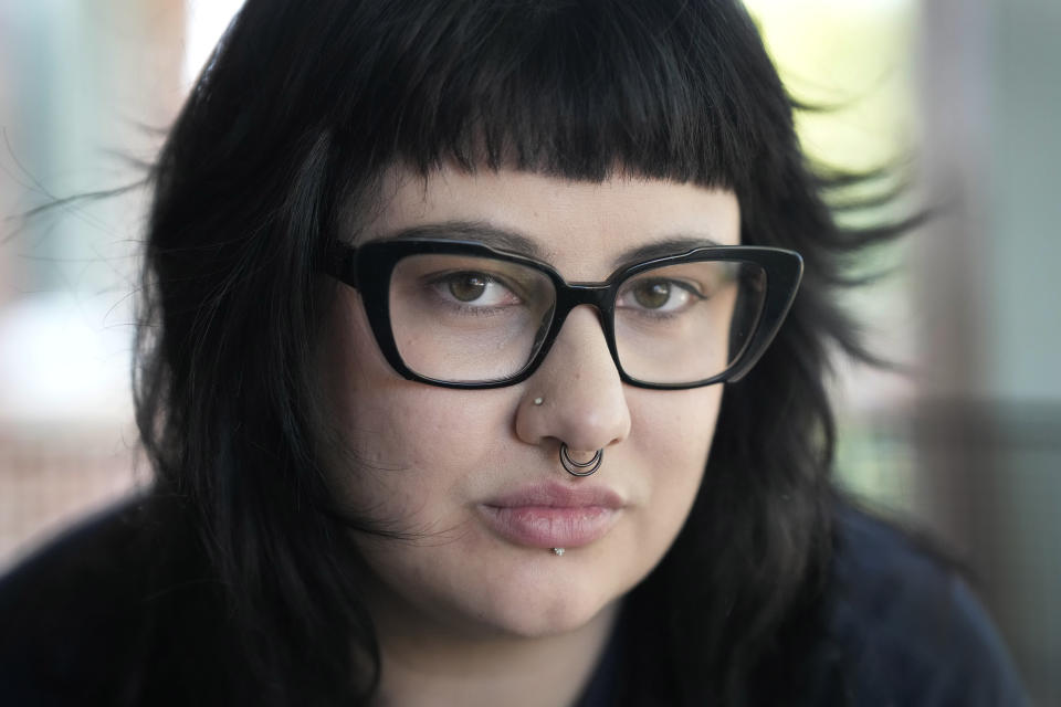 Beka Favela sits for a portrait at her Westmont, Ill., apartment, Tuesday, June 20, 2023. After a payment pause that has lasted more than three years, more than 40 million student loan borrowers will be on the hook for payments starting in the fall. (AP Photo/Charles Rex Arbogast)