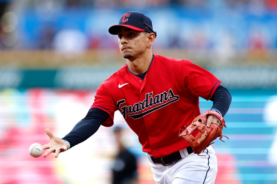 Cleveland Guardians' Andres Gimenez throws out Detroit Tigers' Victor Reyes at first base during the third inning of a baseball game Friday, July 15, 2022, in Cleveland. (AP Photo/Ron Schwane)