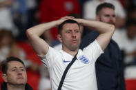 England fans react after Italy won the Euro 2020 soccer championship final match between England and Italy at Wembley stadium in London, Sunday, July 11, 2021. Italy defeated England 3-2 in a penalty shootout after the game ended in a 1-1 draw. (Carl Recine/Pool Photo via AP)