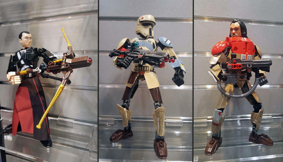 Lego's new buildable "Star Wars" action figures include Chirrut îmwe, a Scarif Stormtrooper and Baze Malbus. ($24.95) <cite>Hanneke Weitering</cite>