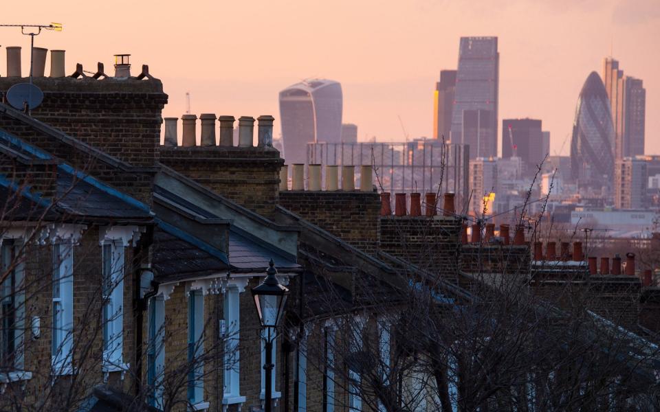 Houses in south London and the skyline of the financial district of the City of London