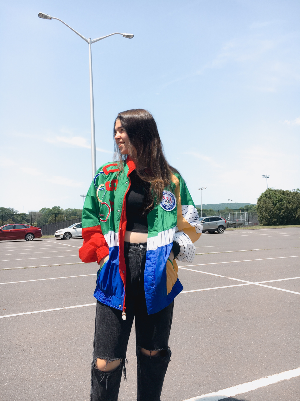 Melissa Fraistat, 22, shows off the jacket, vintage jeans and crop top she thrifted.