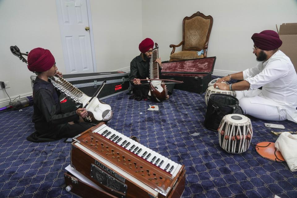 Makheer Singh, center, warms up with two other musicians at the Shri Guru Singh Sabha of Walnut on July 4, 2023, Walnut, CA. USA. Singh performed at the Gurdwara as part of the 4th of July Kirtan Darbar event hosted by the Walnut Gurdwara.