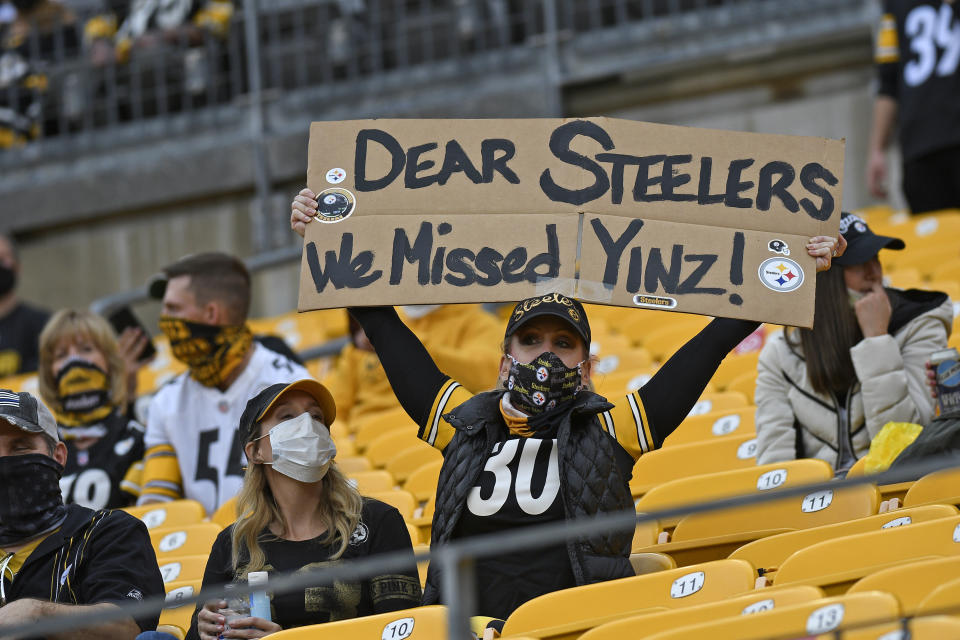 A Pittsburgh Steelers fan holds a sign during the first half of an NFL football game against the Philadelphia Eagles in Pittsburgh, Sunday, Oct. 11, 2020. (AP Photo/Don Wright)