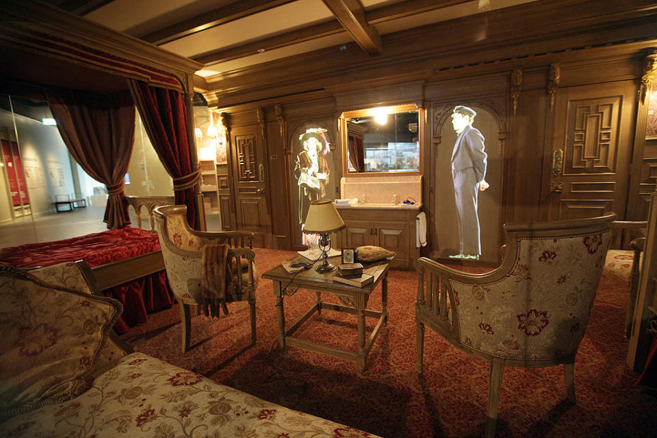 lavish canopy bed, couch, and seating area in the room