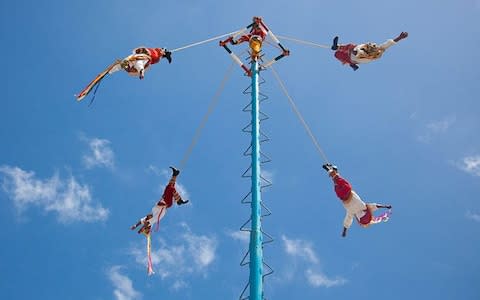 Mayan Indians take part in the Palo Volador in Guatemala Photo: Alamy - Credit: Alamy