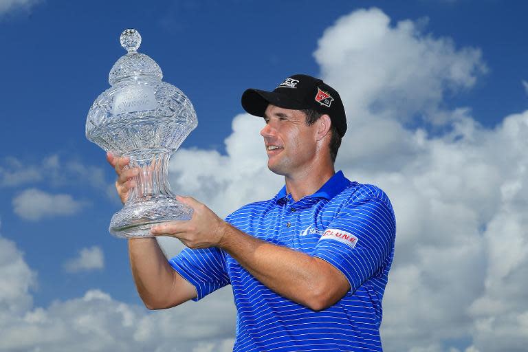 Padraig Harrington of Ireland poses with the trophy after winning The Honda Classic on March 2, 2015 in Palm Beach Gardens, Florida