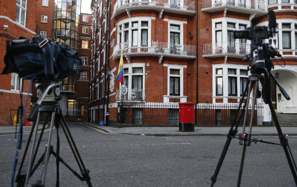 Cameras point at the Ecuadorian embassy where WikiLeaks founder Julian Assange has been holed up for more than four years in London, Wednesday, Jan. 18, 2017. U.S. President Barack Obama's decision Tuesday to commute Chelsea Manning's sentence brought fresh attention to another figure involved in the Army leaker's case: Julian Assange. (AP Photo/Frank Augstein)