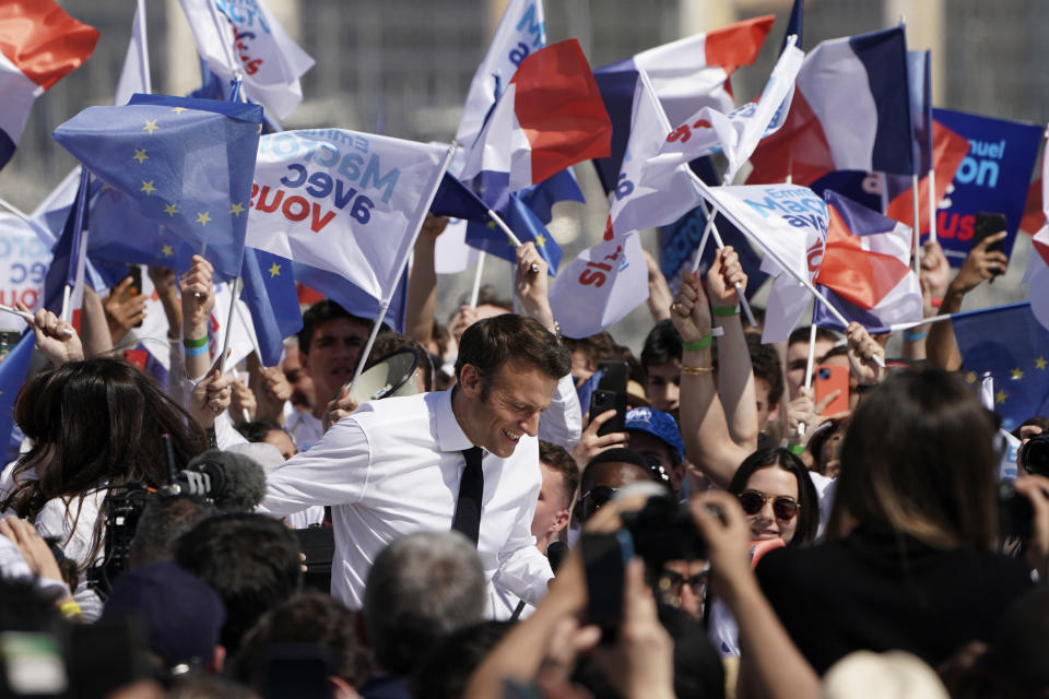 French President and centrist candidate Emmanuel Macron arrives at a campaign rally, Saturday, April 16, 2022 in Marseille, southern France. Far-right leader Marine Le Pen is trying to unseat centrist President Emmanuel Macron, who has a slim lead in polls ahead of France's April 24 presidential runoff election. (AP Photo/Laurent Cipriani)