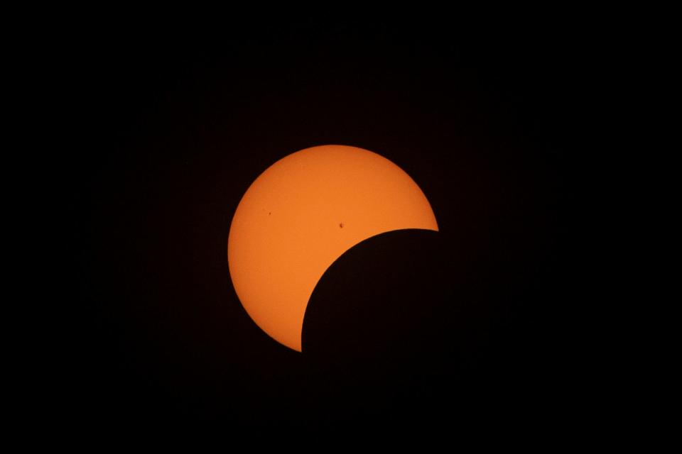 The partial phases of the total solar eclipse in Evansville, Ind., Monday, April 8, 2024.