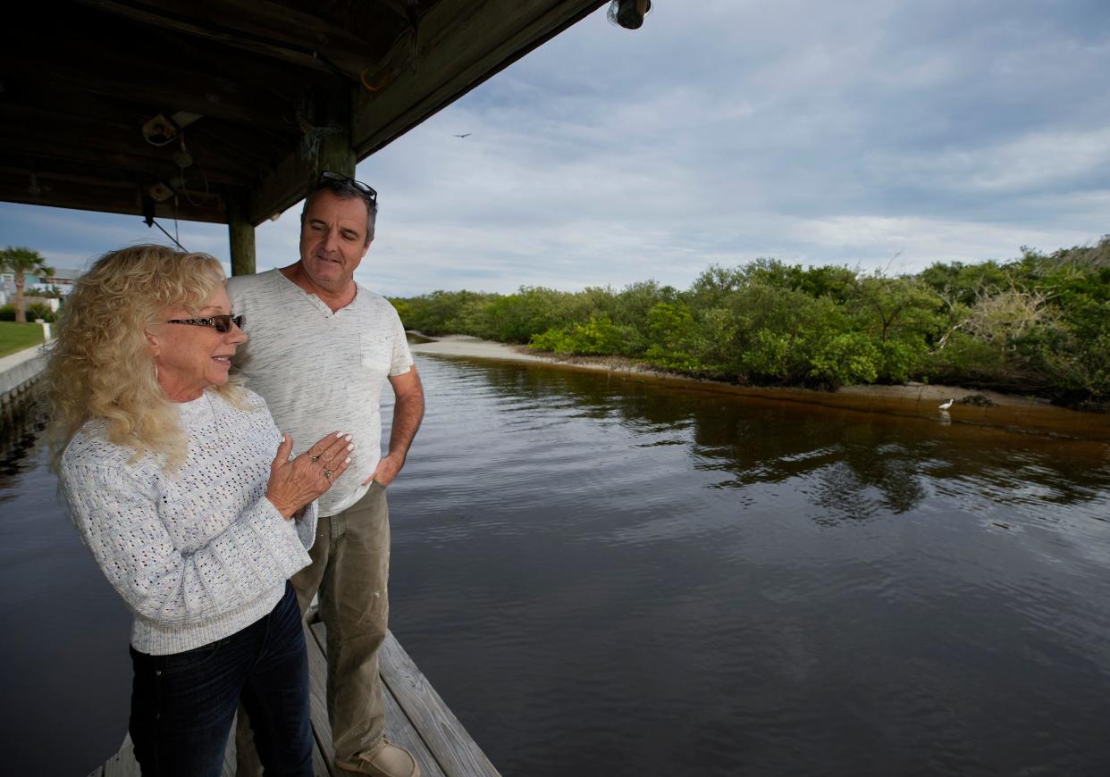 Paul and Diane Caron speak about the Riverside Conservancy project to restore the mangrove and oyster reef along their property in Ponce Inlet, Thursday, Nov. 30, 2023.