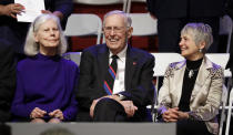 FILE - Former Tennessee Gov. Don Sundquist, center, sits with his wife, Martha, left, and Andrea Conte, right, wife of former Gov. Phil Bredesen, before the inauguration of Gov.-elect Bill Lee in War Memorial Auditorium, Jan. 19, 2019, in Nashville, Tenn. Former governor Sundquist died at Baptist East Hospital in Memphis on Sunday, Aug. 27, 2023, according to a family spokeswoman. (AP Photo/Mark Humphrey, File)