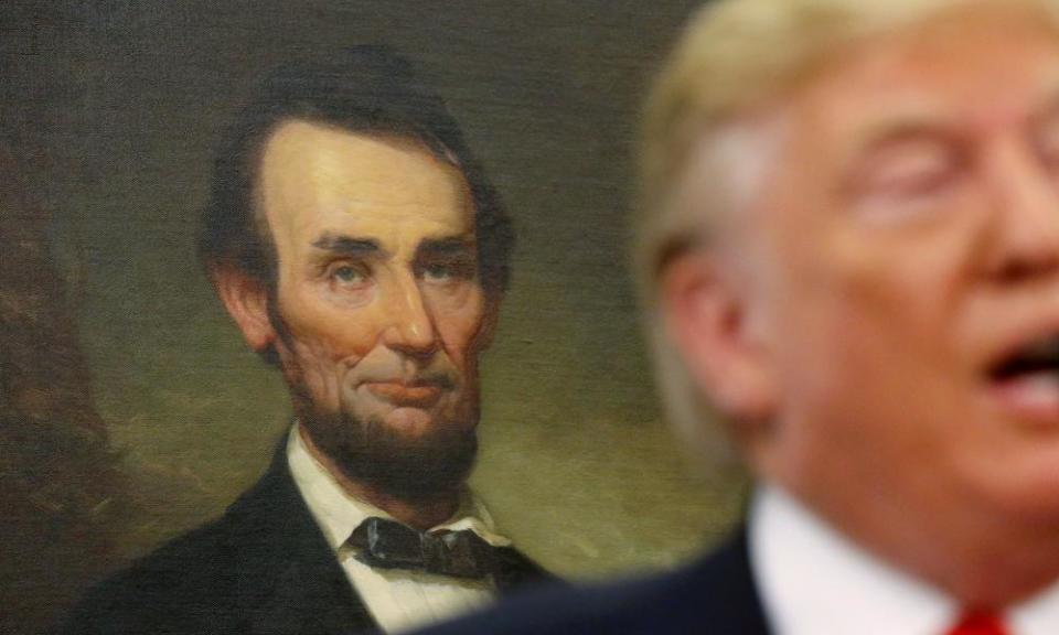 A portrait of Abraham Lincoln hangs in the background as Donald Trump speaks at the White House.