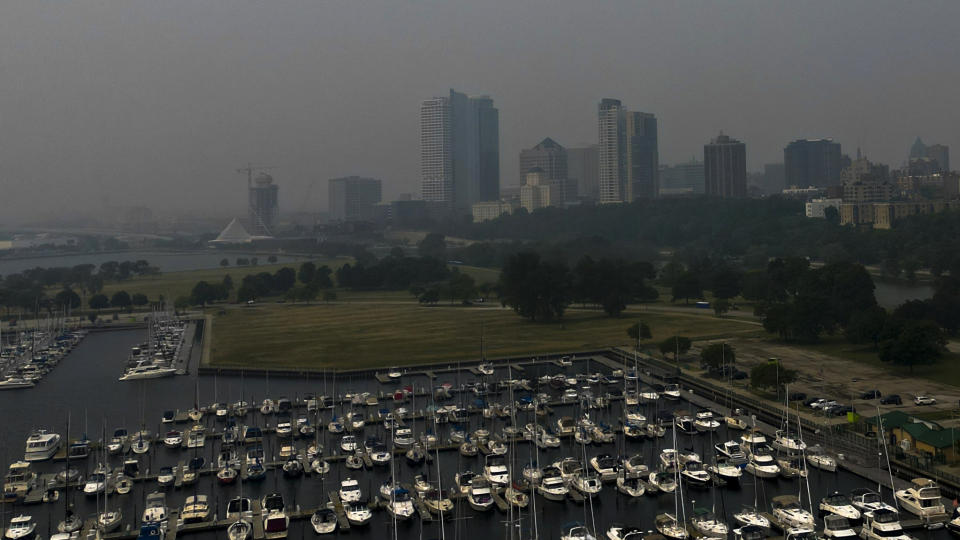 A haze from Canadian wildfires is seen over Milwaukee, Tuesday, June 27, 2023. The haze from Canadian wildfires, which, along with higher ozone levels is continuing to create low visibility conditions and lead to air quality alerts throughout the area. (AP Photo/Morry Gash)
