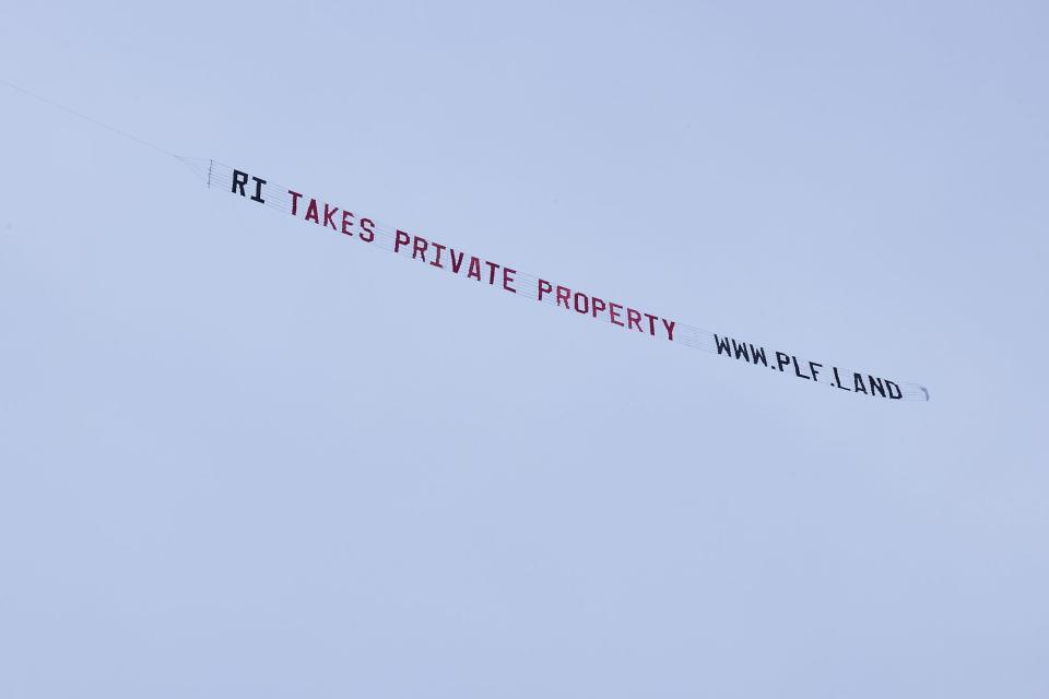 The Pacific Legal Foundation, which is fighting Rhode Island's new shoreline access law, hired a plane to fly a banner saying "RI TAKES PRIVATE PROPERTY" in July.